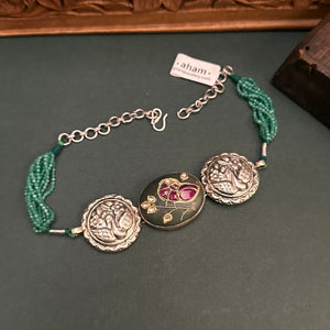 Flaunt this beautiful Ira Choker crafted in 92.5 silver with stone inlay work in the center. Looks great with both ethnic and western outfits.