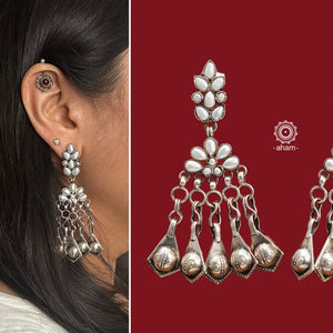 These handcrafted Ira earrings are made from 92.5 sterling silver, making them a stunning addition to any outfit. The stunning pearl work and statement Ghungroos make these earrings perfect for special occasions and festivities. Elevate your look with these exquisite and unique earrings.