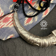 Handcrafted tribal silver Hasli with adjustable cotton thread. Worn typically by the Fakirani Jat tribe of Kutch. The Hasli can be worn both ways, front and back.