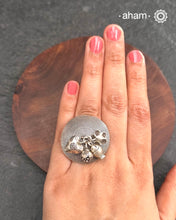 Adjustable Ring in 92.5 sterling silver with different charms.Perfect piece to add a playful touch to your look.