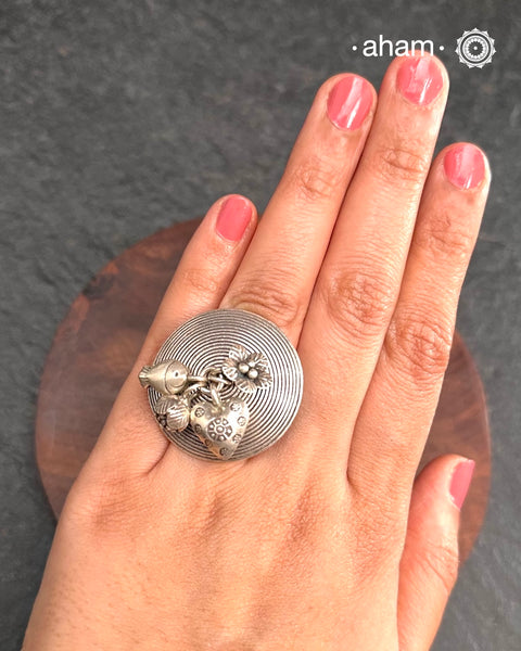 Adjustable Ring in 92.5 sterling silver with different charms.Perfect piece to add a playful touch to your look.