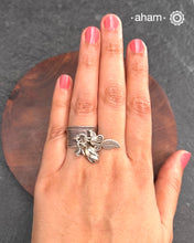 Adjustable Ring in 92.5 sterling silver with different charms.Perfect piece to add a playful touch to your look.