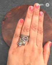 Adjustable Ring in 92.5 sterling silver with different charms.Perfect piece to add a playful touch to your look.