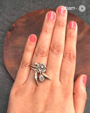 Adjustable Ring in 92.5 sterling silver with different charms.Perfect piece to add a playful touch to your look.