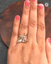 Adjustable Ring in 92.5 sterling silver with different charms. Perfect piece to add a playful touch to your look.