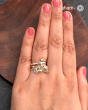 Adjustable Ring in 92.5 sterling silver with different charms. Perfect piece to add a playful touch to your look.