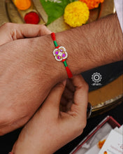 Beautiful Silver Rakhi. Make this Rakshabandhan Memorable with this handcrafted Rakhi for an ever-lasting Knot.Blessings of prosperity with Rakhi crafted in Silver Kundan work with cotton thread.