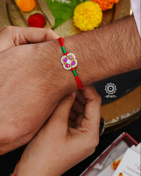 Beautiful Silver Rakhi. Make this Rakshabandhan Memorable with this handcrafted Rakhi for an ever-lasting Knot.Blessings of prosperity with Rakhi crafted in Silver Kundan work with cotton thread.