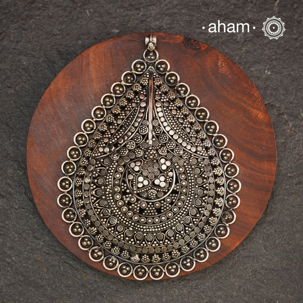 Expertly crafted in 92.5 silver, the Mewad Silver Pendant features intricate tar and rava work, making it a stunning statement piece. Elevate your look with this versatile pendant that exudes elegance and style. (Does not include chain)