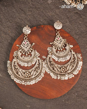 These Statement Silver Chandbali Earrings feature a bold, large design that commands attention. Expertly crafted in silver, they combine traditional crescent shapes with a contemporary edge, making them ideal for elevating your look with a sophisticated yet striking accessory. Perfect for those who value both craftsmanship and standout style.