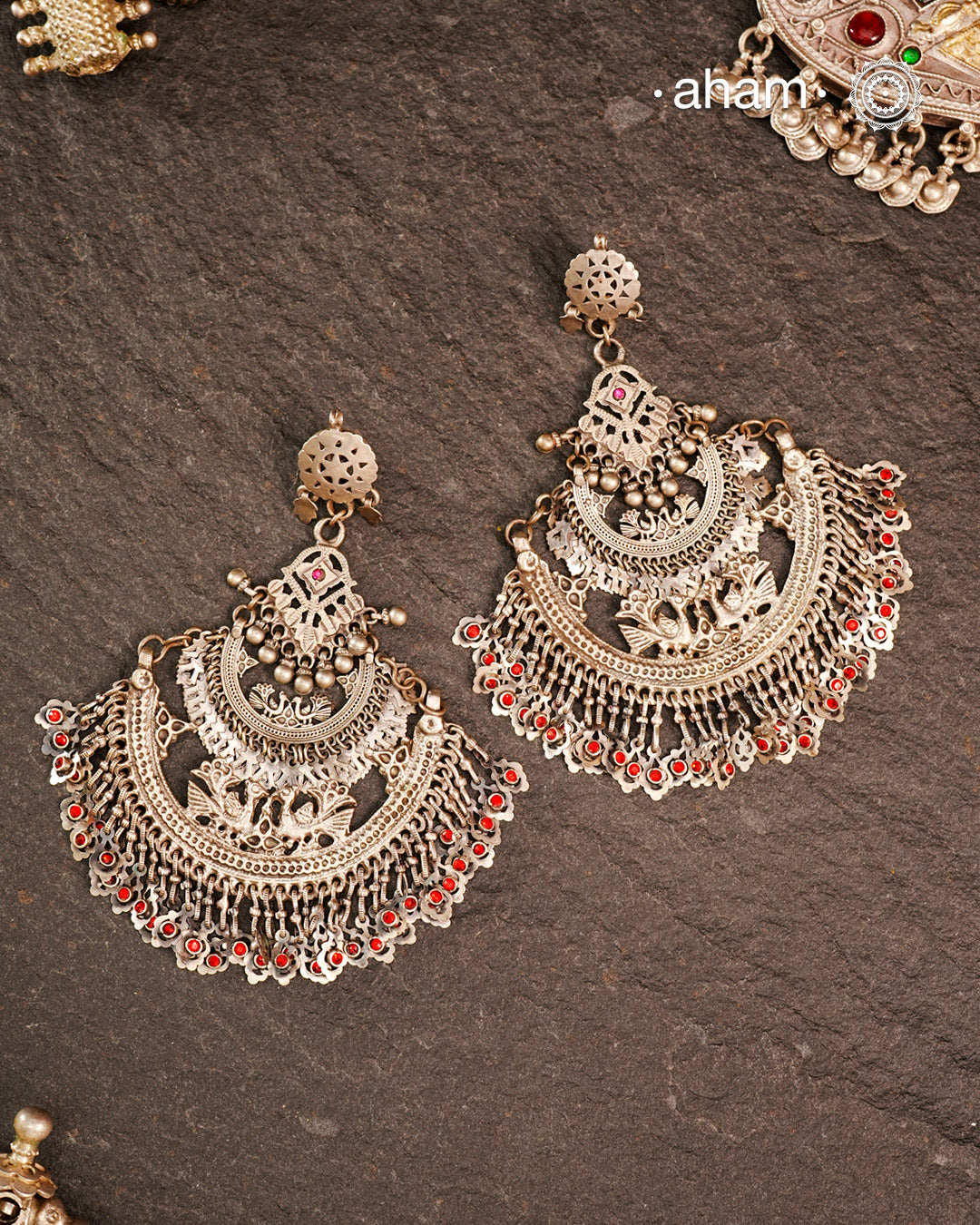 These Statement Silver Chandbali Earrings feature a bold, large design that commands attention. Expertly crafted in silver, they combine traditional crescent shapes with a contemporary edge, making them ideal for elevating your look with a sophisticated yet striking accessory. Perfect for those who value both craftsmanship and standout style.