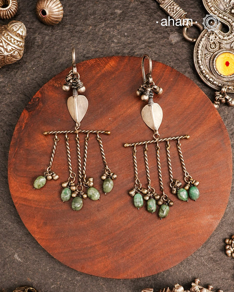 Adding drama to traditional tribal silver earring. One of a kind statement earring.