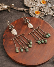 Adding drama to traditional tribal silver earring. One of a kind statement earring.