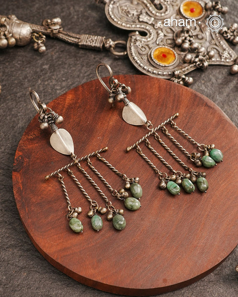 Adding drama to traditional tribal silver earring. One of a kind statement earring.