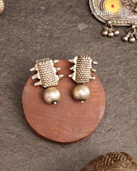 An exquisite fusion of the past and present, these Vintage Tribal Earrings unite two stunning silver pieces. The top features vintage amulets steeped in history, while the bottom showcases a beautiful bead. Handcrafted in silver, this unique piece is a must-have for those who cherish tribal heritage jewellery with a story to tell.