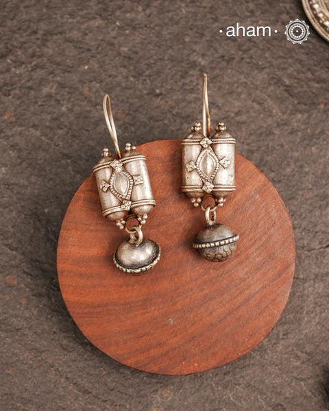 An exquisite fusion of the past and present, these Vintage Tribal Earrings unite two stunning silver pieces. The top features vintage amulets steeped in history, while the bottom showcases a beautiful bead. Handcrafted in Silver, this unique piece is a must-have for those who cherish tribal heritage jewellery with a story to tell.