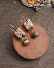 An exquisite fusion of the past and present, these Vintage Tribal Earrings unite two stunning silver pieces. The top features vintage amulets steeped in history, while the bottom showcases a beautiful bead. Handcrafted in Silver, this unique piece is a must-have for those who cherish tribal heritage jewellery with a story to tell.
