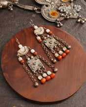 These silver earrings are sourced from the Turkmen central Asia regions.&nbsp;The dents, the marks, the irregularities all add to the charm and tell a story of where they comes from.