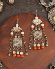 These silver earrings are sourced from the Turkmen central Asia regions. The dents, the marks, the irregularities all add to the charm and tell a story of where they comes from.