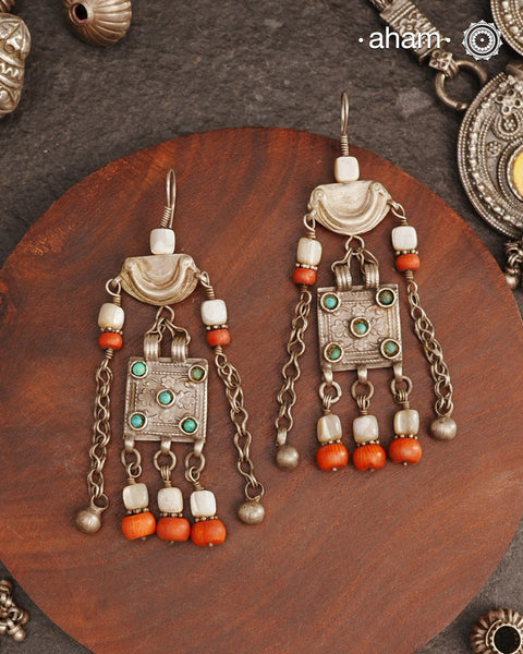 These silver earrings are sourced from the Turkmen central Asia regions. The dents, the marks, the irregularities all add to the charm and tell a story of where they comes from.