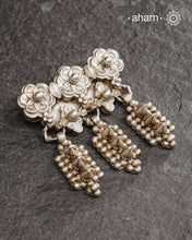 A vintage piece that we found in one of our scouring expeditions. Seems to be a piece of a vintage belt bulk which we have converted into a pendant. A solid, bold, Very unusual piece from a bygone area, that bring back memories and stories of that time. Wear it with a long chain or with a black thread, or layer them to create a distinct look.