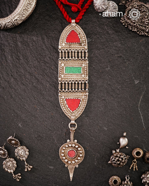 A beautiful vintage silver piece with bright green and red glass highlights.
We don't know what was the original form or purpose of this piece, but it we have added a thread to the loop at the top and it looks stunning as a pendant piece. The silver is of high quality. A very interesting piece that is not to be missed out.