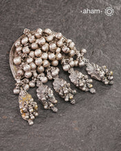 Originally part of the leg phool (Leg anklet with toe rings) the main piece has been converted into a stunning pendant. Lots of ghungroos add to the rustic charm of the piece. Beautiful handcrafted tribal silver pendant from a bygone area, that bring back memories and stories of that time. Wear it with a long chain or with a black thread, or layer them to create a distinct look.