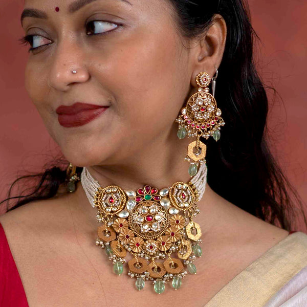 Traditional Jewellery perfect for family weddings.  Beautiful antique finish neckpiece set intricately embedded in the  lustre of precious coloured stones and pearls. A stunning addition to your wedding look. The beautiful workmanship is something that can be cherished and passed on for generations to come