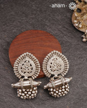 An exquisite fusion of the past and present, these Vintage Tribal Earrings unite two beautiful silver pieces.&nbsp; The top features an intricate leaf pattern stud&nbsp;while the bottom showcases a vintage amulet, steeped in history. Handcrafted in&nbsp;silver, this unique piece is a must-have for those who cherish tribal heritage jewellery with a story to tell.