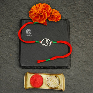 Beautiful Handcrafted Silver Rakhi for little kids.  Make this Rakshabandhan Memorable with this handcrafted Rakhi for an ever-lasting Knot. Super cute Rakhi in 925 Silver dial weaved with cotton thread. Tip: you can later convert this into a key chain charm or a pendant as well Price is for one piece rakhi Only  Roli (kumkum), Akshat (Chawal) and  Mishri shipped along with India orders only