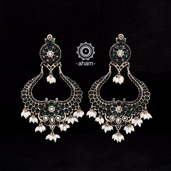 Large, 92.5 Sterling silver earrings with green spinel stone setting.  Make heads turn with these gorgeous pair of handcrafted earrings. 