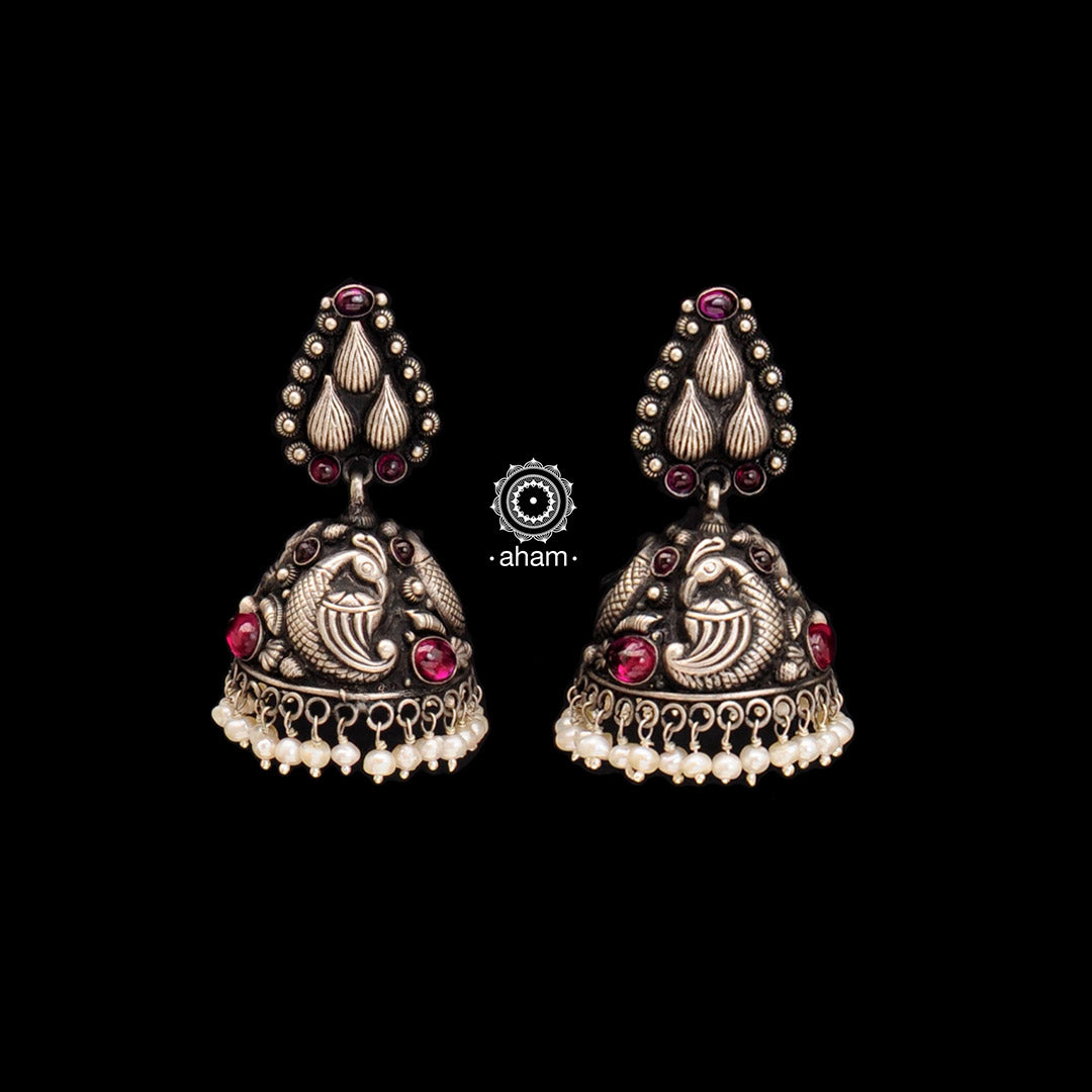 Elegant and beautifully crafted nakshi peacock jhumkie earrings. Handcrafted in 92.5 sterling silver, with maroon kemp stone and cultured pearls.
