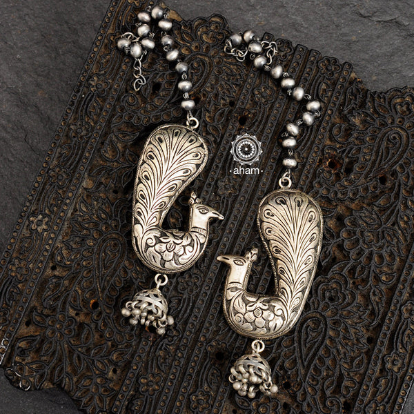 Mewad peacock silver earrings in 92.5 with beautiful Chitai work. An ode to the glorious state of Rajasthan.