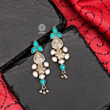 Perfect summer wear earrings crafted in 92.5 silver with turquoise and pearl highlights. 