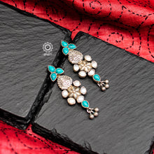 Perfect summer wear earrings crafted in 92.5 silver with turquoise and pearl highlights. 