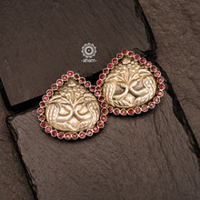 Summer love drop stud earrings with intricate double peacock motif. Handcrafted in silver with maroon coloured stone setting. Looks great with your everyday ethnic outfits.