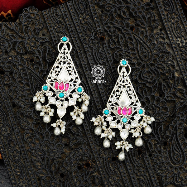 Make your special occasion even more special with these handcrafted 92.5 sterling silver danglers with intricate floral motifs and playful ghungroos that will complete your look. Style this up with your favourite ethnic or fusion outfit