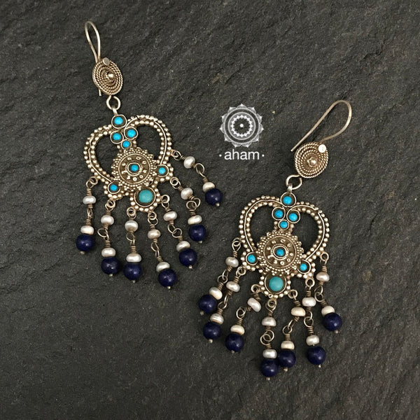 The earrings are sourced from the Turkmen central Asia regions.  The dents, the marks, the irregularities all add to the charm and tell a story of where they comes from.