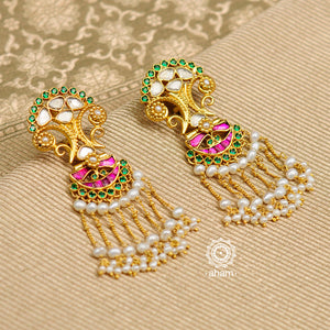 Beautiful gold polish earrings with semi precious stone setting. Handcrafted in 92.5 sterling silver with kundan work and dangling cultured pearls.