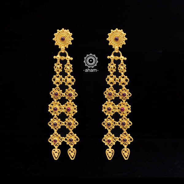 This statement flower earring showcases exquisite craftsmanship, created using the ancient South Indian technique of crafting temple jewelry in 92.5% pure silver and dipped in gold. Its unique design is a testament to expert artistry and timeless beauty, sure to captivate attention.