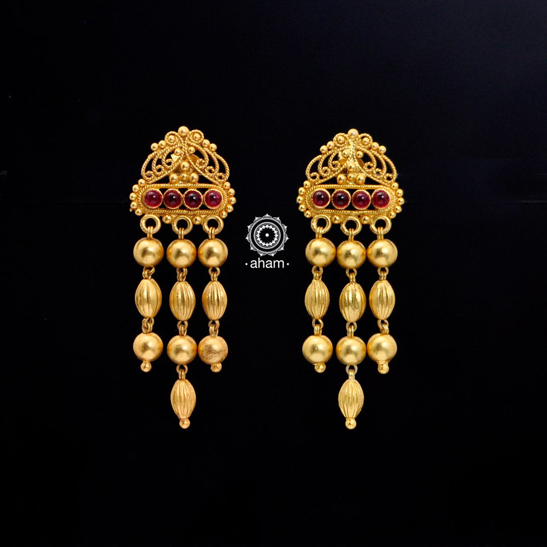 Catch everyone's attention with this beautiful Sterling Silver (92.5%) uniquely designed earring. Crafted using ancient South Indian antique gold temple jewellery technique, the entire piece is made in pure silver and dipped in gold.