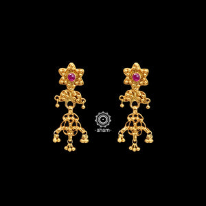Catch everyone's attention with this beautiful Silver (80%) uniquely designed earring. Crafted using ancient South Indian antique gold temple jewellery technique, the entire piece is made in pure silver and dipped in gold.