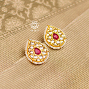 Feel like royalty when dressed in these Thappa Kundan silver drop earrings with a red semi precious stone in the center and cultured pearls. Style this up with your favourite ethnic or fusion outfit