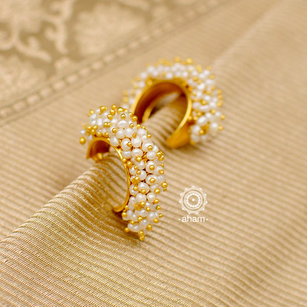 Feel like royalty when dressed in these stunning gold polish silver earrings with cultured pearls. Crafted using traditional techniques in 92.5 sterling silver. Perfect for special occasions and upcoming festive celebrations.  
