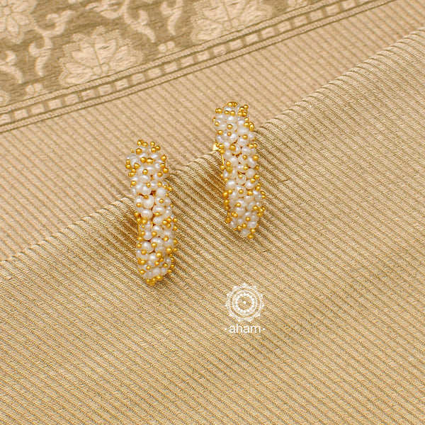 Feel like royalty when dressed in these stunning gold polish silver earrings with cultured pearls. Crafted using traditional techniques in 92.5 sterling silver. Perfect for special occasions and upcoming festive celebrations.  