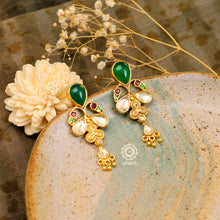 Handcrafted green drop 92.5 sterling silver earrings with elegant bird motifs in gold polish and kundan setting. Lightweight earrings looks great with ethnic and fusion outfits.