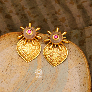Feel like royalty when dressed in these gold polish silver earrings with rose quartz stone. Crafted using traditional techniques in 92.5 sterling silver with intricate floral work. Perfect for intimate weddings and upcoming festive celebrations. 
