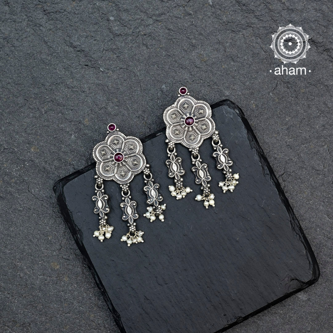 Shivneri flower earrings handcrafted in 92.5 sterling silver. Pair these beautiful dangling earrings with your ethnic outfits to complete the look.