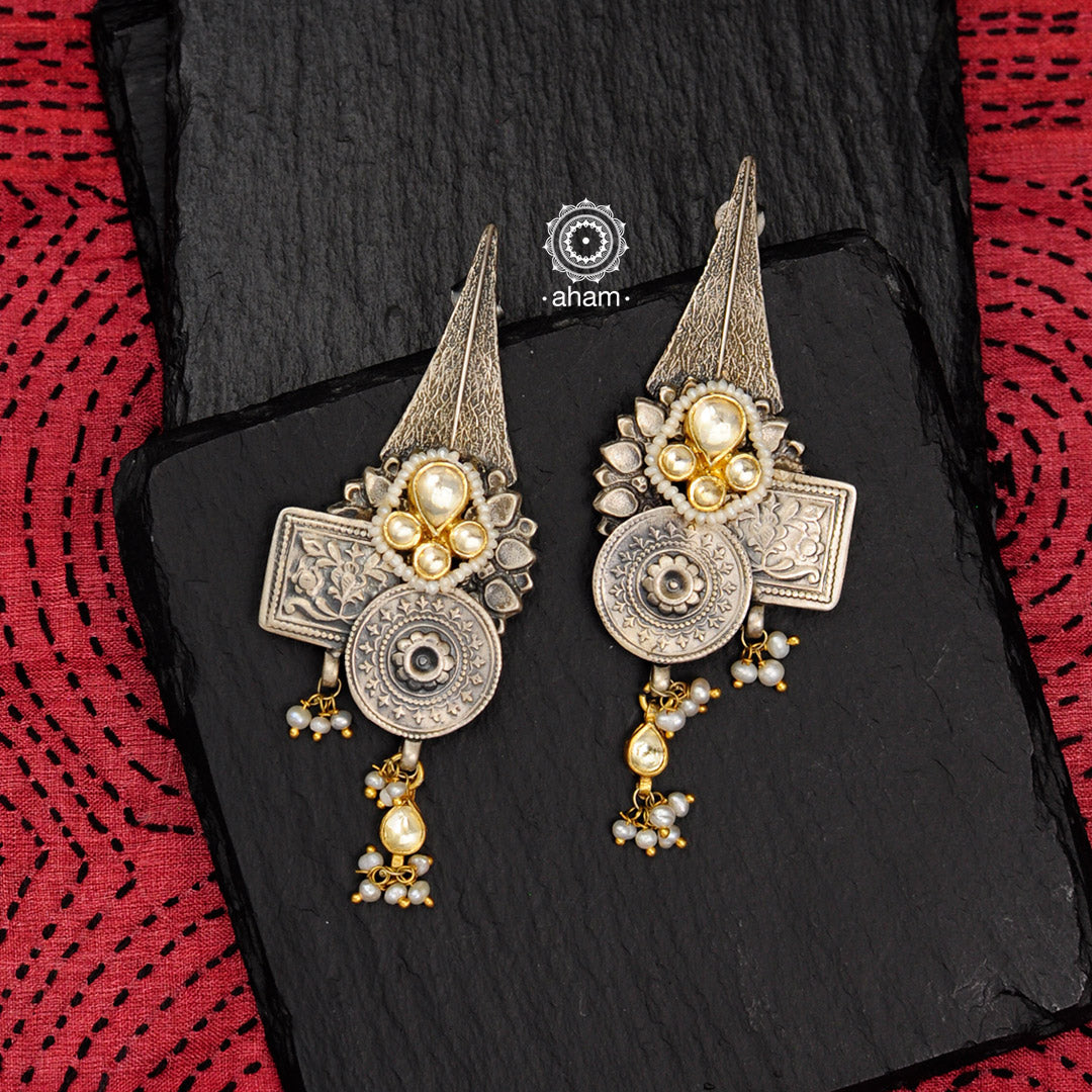 Handcrafted pieces of art put together to create this noori two tone earrings in 92.5 sterling silver with gold polish work, kundan work and cultured pearls. Style this up with your favourite ethnic or fusion outfit