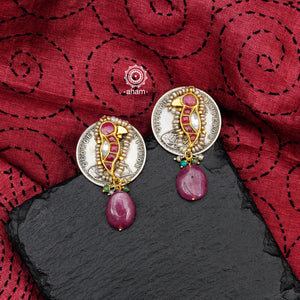 Handcrafted Noori two tone coin earrings in silver with pink semi precious stone. With beautiful bird motif and embellished cultured pearls. Style this up with your favourite ethnic or fusion outfit.